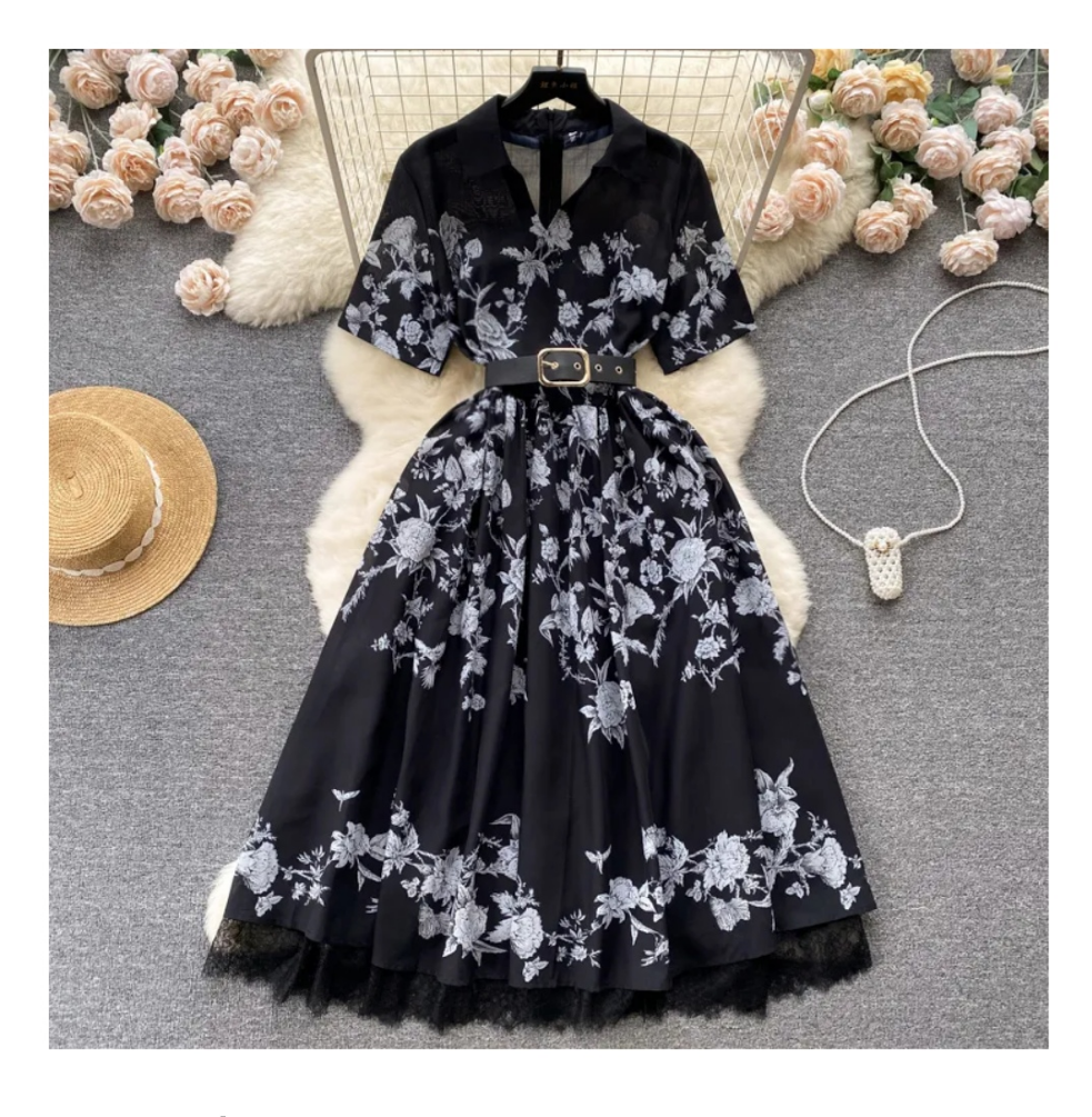 Vestido negro con flores blancas midi